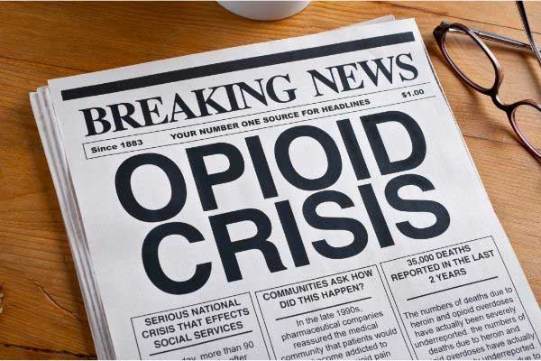 newspaper with an article on opioid crisis